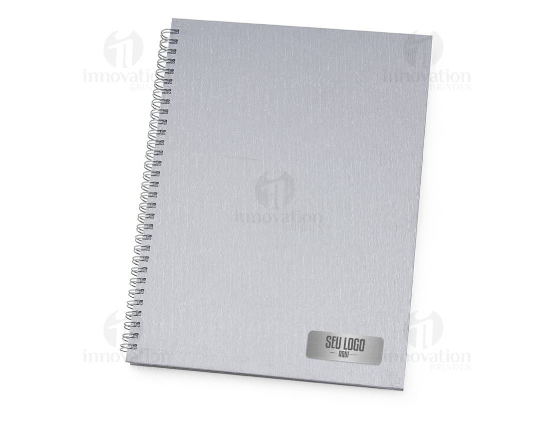 Caderno de Negócios: O acessório ideal para manter suas anotações organizadas no escritório. Com capa dura e páginas em branco, é perfeito para escrever documentos, memorandos e lembretes importantes. Mantenha seu dia a dia mais produtivo com este caderno de alta qualidade!