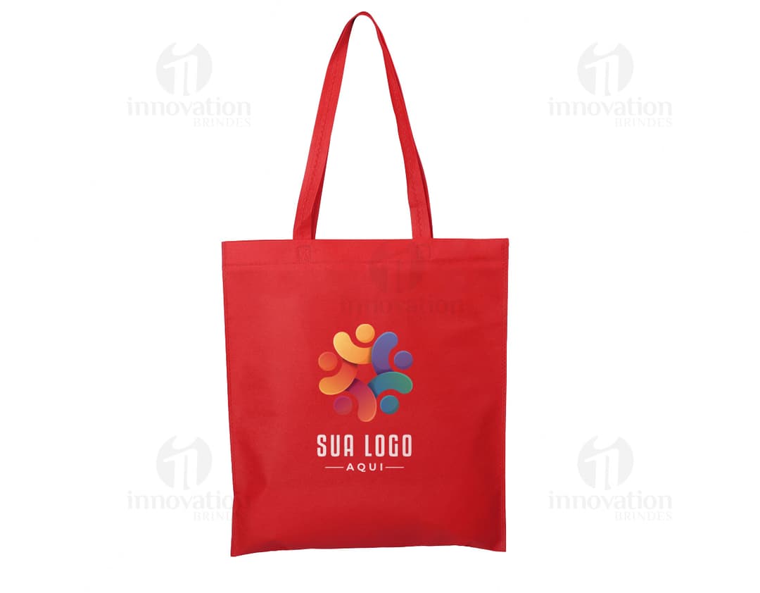 Sacola de compras de tecido não tecido (TNT) de 100g com alça de 60cm. A sacola é amarela e possui um design moderno e colorido. Está vazia e pronta para ser usada para transportar mercadorias. A embalagem é resistente e possui alças fortes para carregar. Ideal para compras, presentes e uso diário.