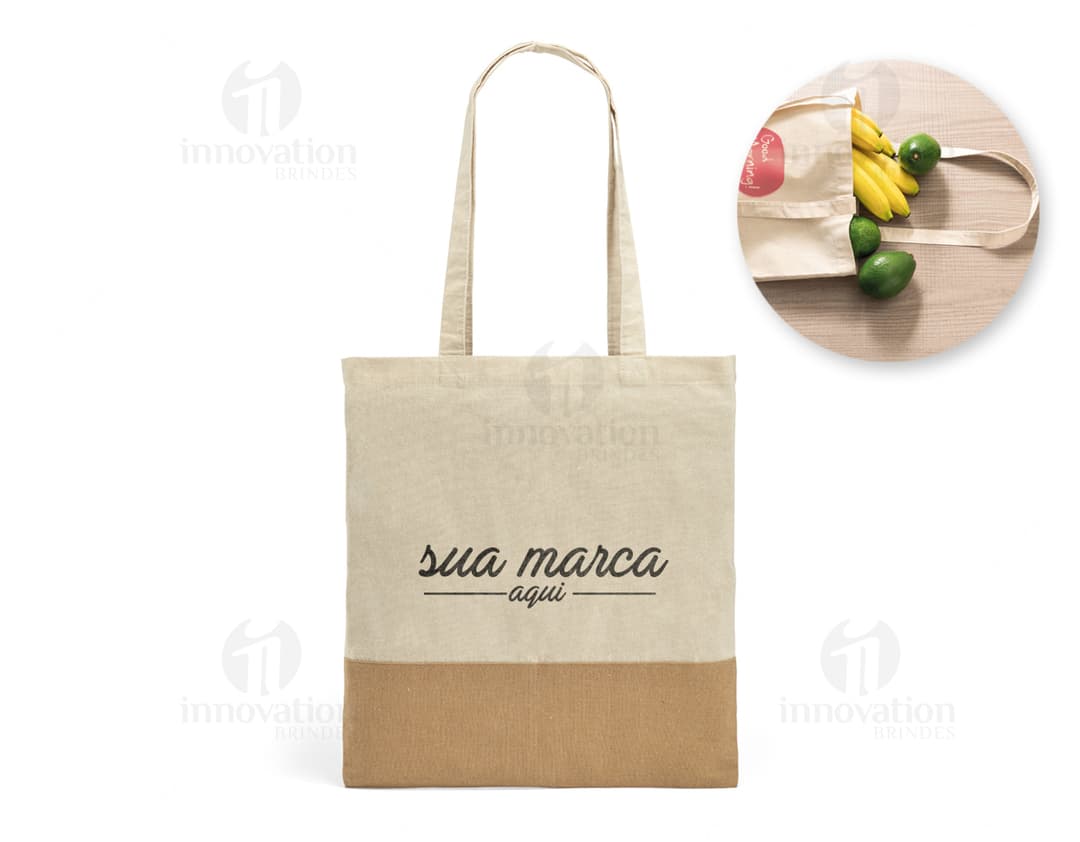Sacola de algodão 160g com detalhes em juta, ideal para compras e presente. Produto seguro, com fecho de segurança e espaço para armazenamento. Design moderno e resistente, perfeito para compras e presente.