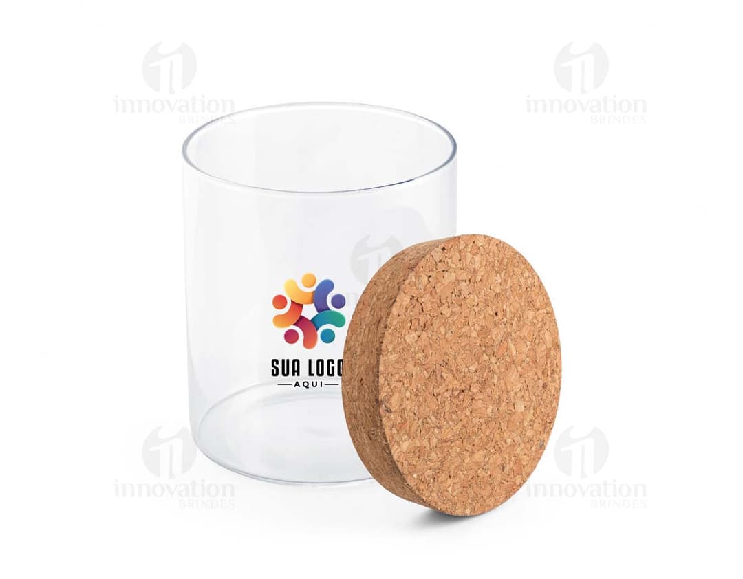 Frasco de vidro transparente com tampa de metal dourada.