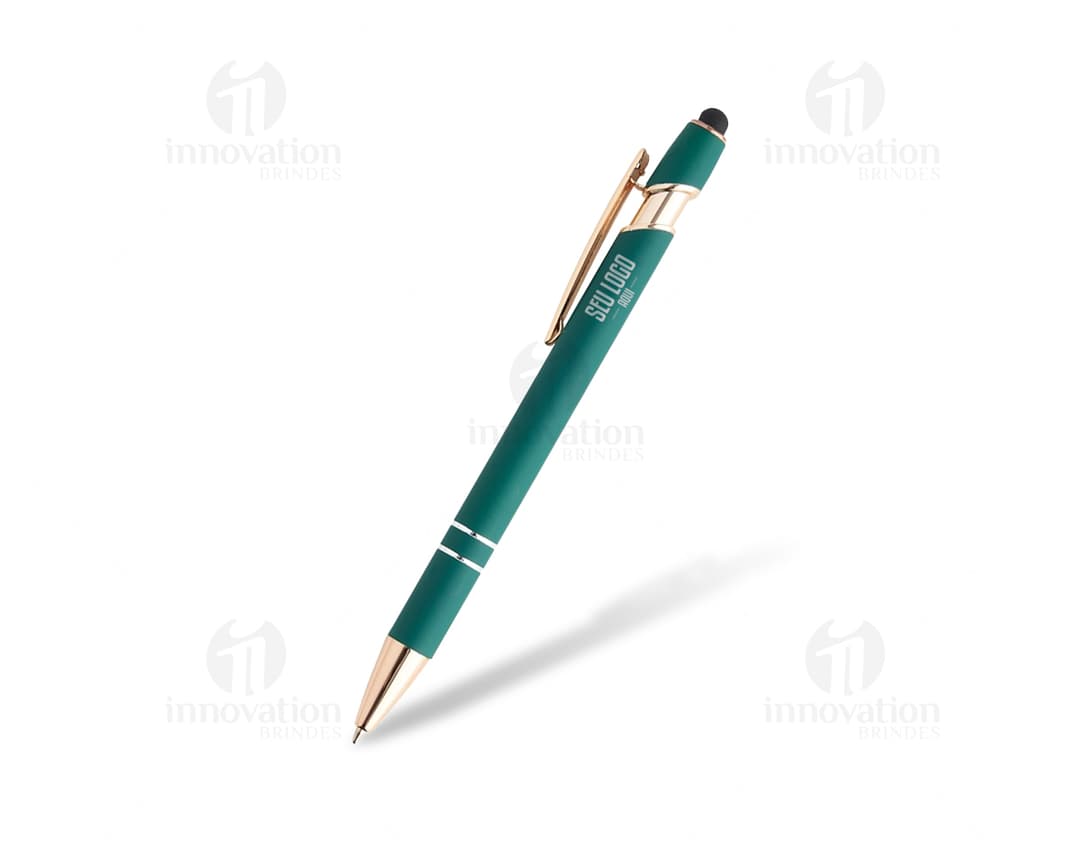 Caneta metálica amarela sobre um papel em branco, ao lado de lápis e borracha. A imagem mostra um objeto de escrita de cor metálica em um cenário de escritório.