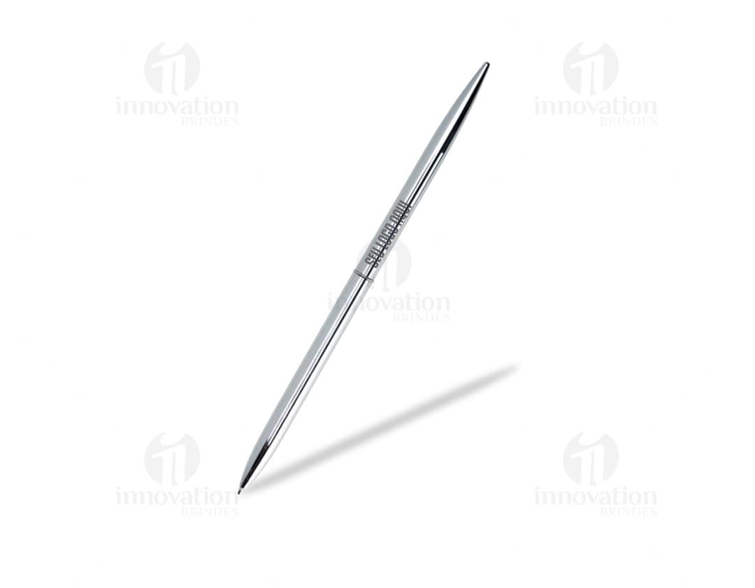 Caneta metálica acionamento por rotação sobre papel em um escritório.