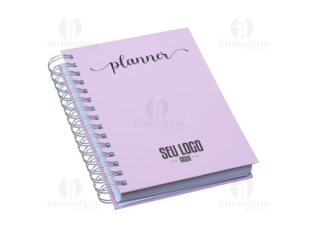 Planner Percalux Anual com capa dura, folhas em branco e marcador de página.