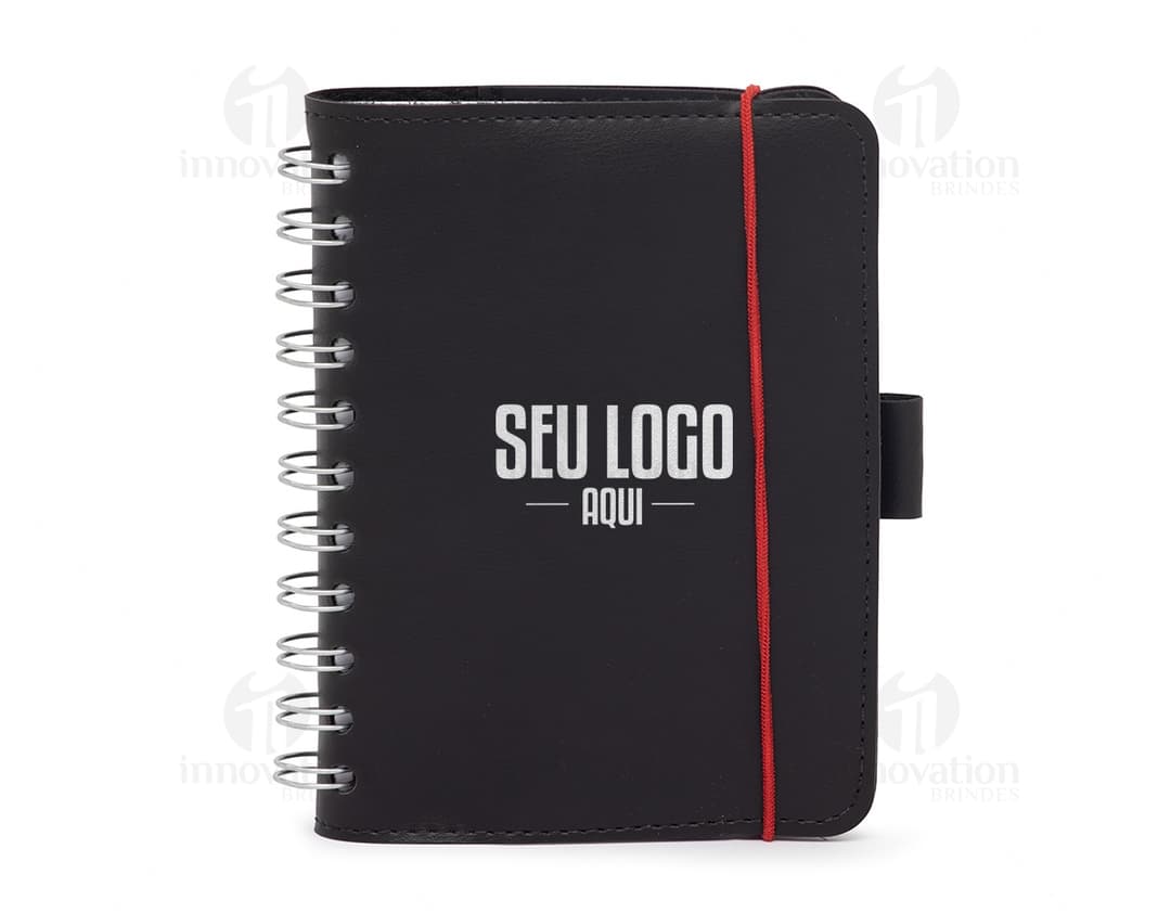 Caderneta de Couro Sintético em uma imagem com elementos como notebook, business, office, paper, technology, black, blank, computer, object, equipment, note, communication, information, book, message, icon, digital, electronic, data, write, device, education, empty, phone, design, hand, pen, page, letter, open, school, mobile, document, finance, symbol, board, sign, binder, media, card, holding, text, work, spiral, electronics, college, web, key, single, box, close, art, set, notepad, diary, modern, old, money, storage, writing, display, camera, clip, laptop, network, sale, man, student, bag.