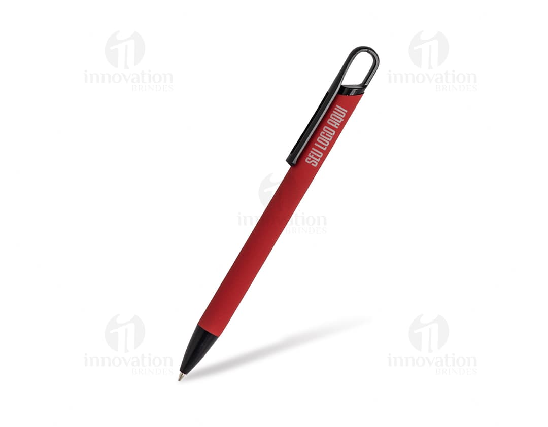 Caneta de metal prateada sobre papel branco, representando um ambiente de escritório ou negócios.