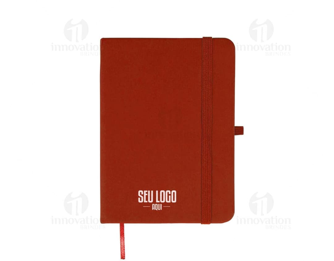 Caderneta Emborrachada preta com detalhes em dourado na capa.