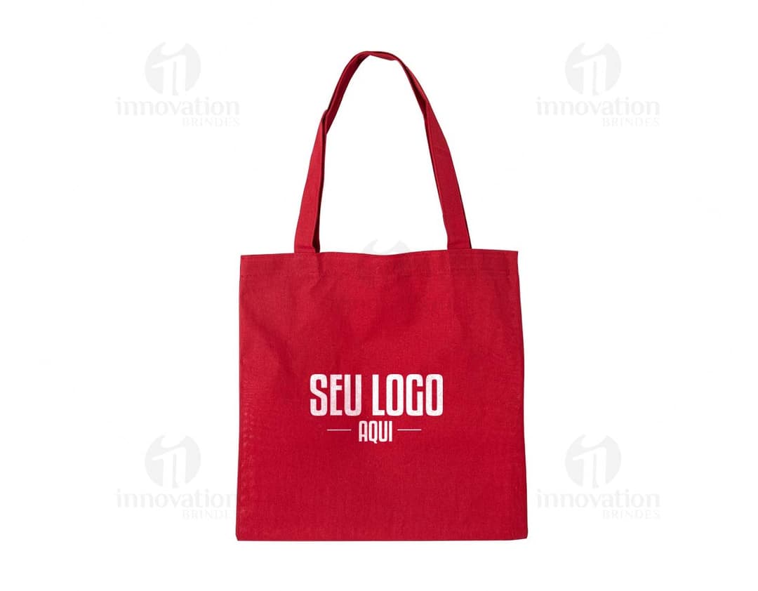 Imagem de uma sacola de algodão com alças reforçadas e estampa de folhas verdes.