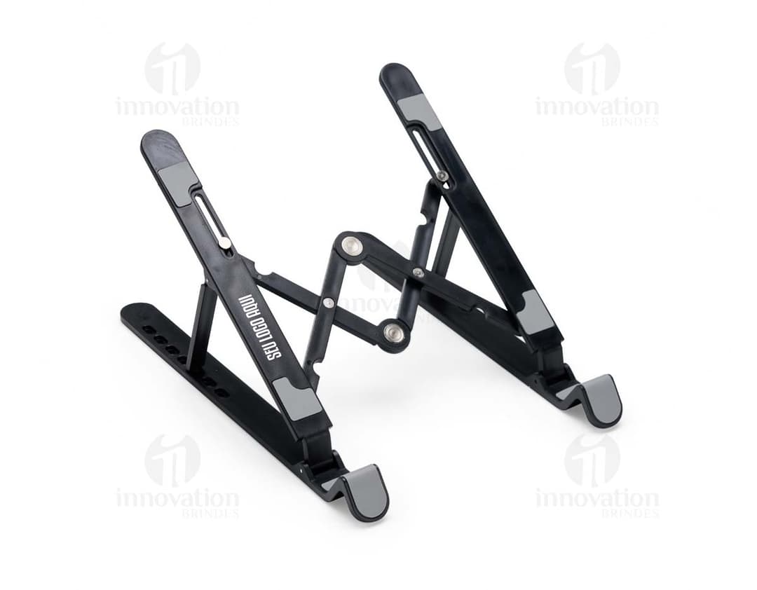 Suporte retrátil para notebook em metal prateado, design industrial e tecnológico. Inclui suporte, assento, Equipamento eletrônico e dispositivo de comunicação.